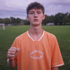FHK in orange shirt
